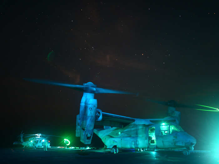 An MV-22 Osprey prepares to take off from the flight deck of the amphibious assault ship USS Kearsarge.