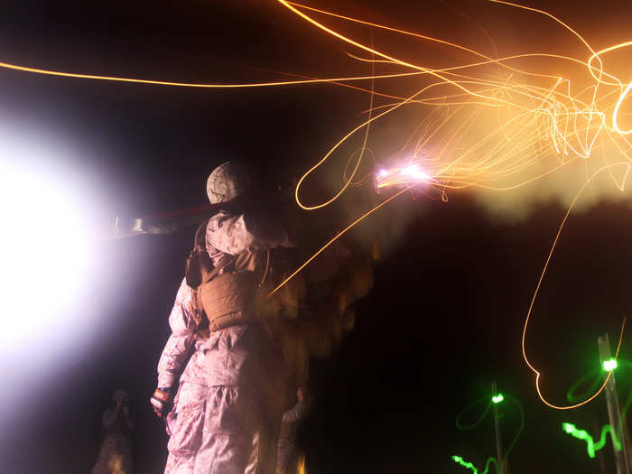 Flames light up the sky as a Marine launches a Stinger Missile at a flying drone in North Carolina.