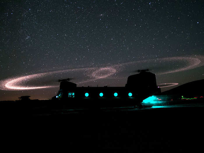 Dust lights up the rotors of a CH-47 Chinook helicopter as paratroopers load for an air assault mission near Ghazni Province, Afghanistan.