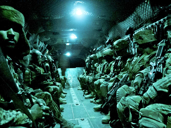 Paratroopers with the 82nd Airborne Division’s 1st Brigade Combat Team and Afghan National Army soldiers aboard a CH-47 Chinook heavy lift helicopter during an air assault mission in Ghanzi province in Afghanistan.