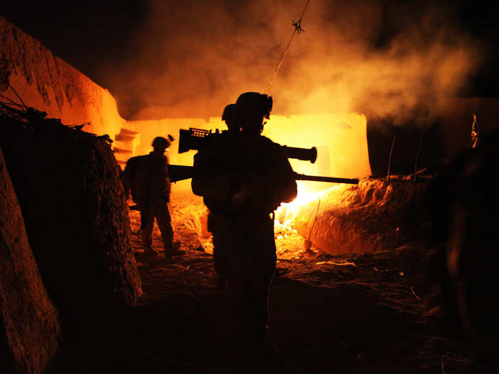 Marines with Scout Sniper Platoon, Alpha Company, 1st Battalion, 1st Marines, Regimental Combat Team 6, leave a compound in Agha Ahmad, Helmand province, on Aug. 27 as a part of Operation Helmand Viper.