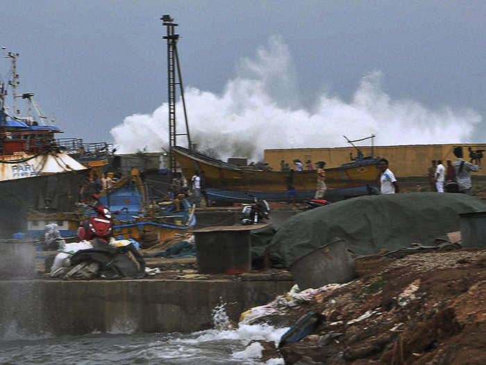 A high-tide wave hits the coastal area of Vishakhapatnam in the state of Andhra Pradesh.