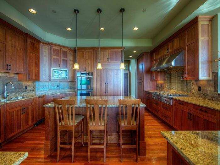 The home features Brazilian cherry wood cabinetry and flooring. WSJ reports that the furnishings aren