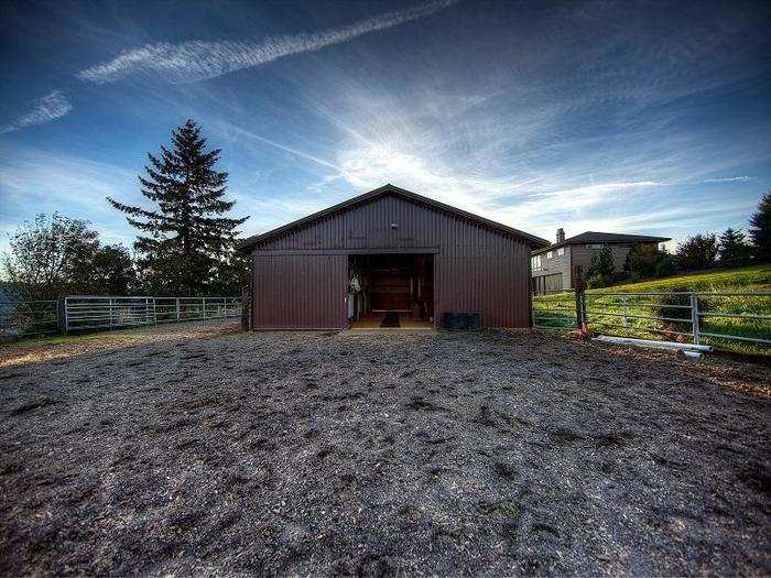 Walking distance from the property is a fenced pasture, sanded arena, and a barn ...