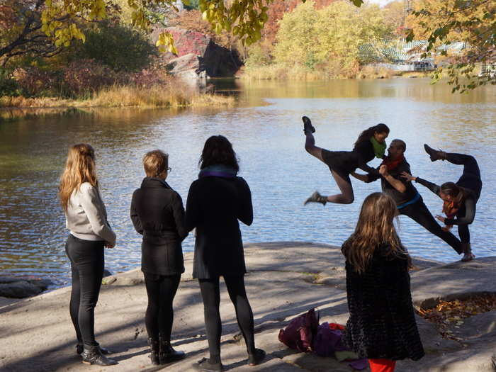 People are always doing activities around the water. This group was practicing acrobatics.