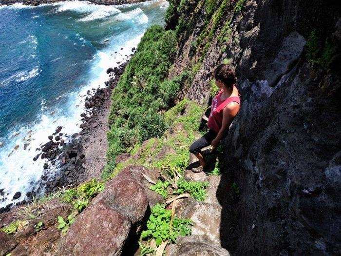 Jacqui Christian, 7th generation descendant of the Bounty, takes a moment to pause on a narrow path called Down Rope.