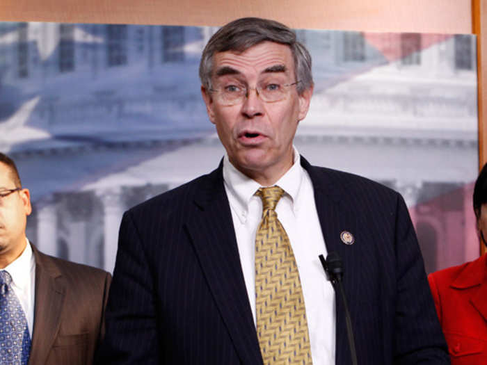 Rep. Rush Holt (D-N.J.) sports a suspiciously dense comb-over and wild prints on his ties. Someone please give the man a pair of tweezers for those caterpillars.