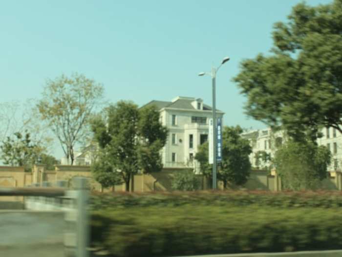 Hangzhou has three million people, making it a small city for China. On the drive from the airport to the campus, I saw a homes like this one.