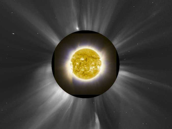 This composite image, taken in November during a solar eclipse, shows the sun behind the moon, combined with the outflow of the solar corona — the charged particles flowing out of the sun