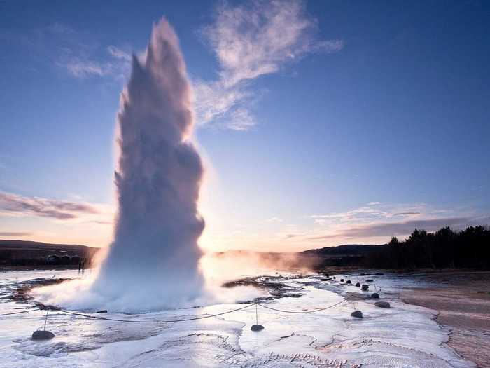 The Strokkur geyser in Iceland erupts every four to eight minutes, blasting water up to 130 feet into the air. Hot magma under the Earth heats water until it spews out of a hole in the ground.