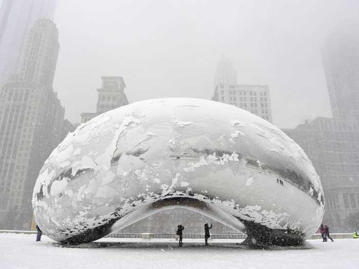 Chicago monument "Cloud Gate," better known as "the bean," wore a layer of ice as a major blizzard dropped just under 10 inches of snow on Chicago in March.