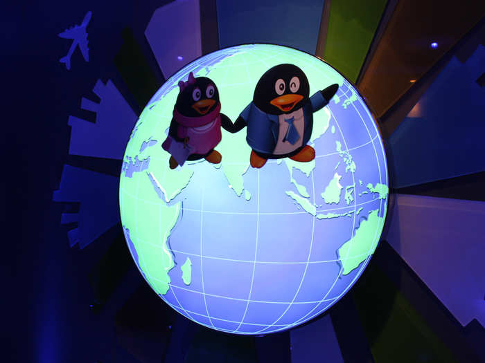 The QQ mascots were all over the place. (Fun to see a globe centered on China, not the USA)