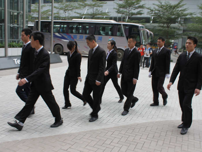 As we left, this band of uniformed security guards walked by in formation.
