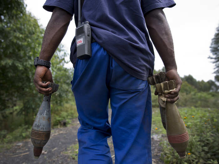 A MONUSCO member of the United Nations Mine Action Coordination Centre recovers abandoned ammunition from in and around the Goma-Kibati area, following the recent conflict between FARDC and M23 rebels.