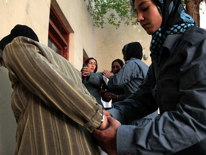 There are two parts to the mission: the political (which has helped legitimize elections) and the developmental (which has aided in relief and infrastructure rebuilding). Here, the UN trains Afghan policewomen in the hopes of improving access to justice for all.