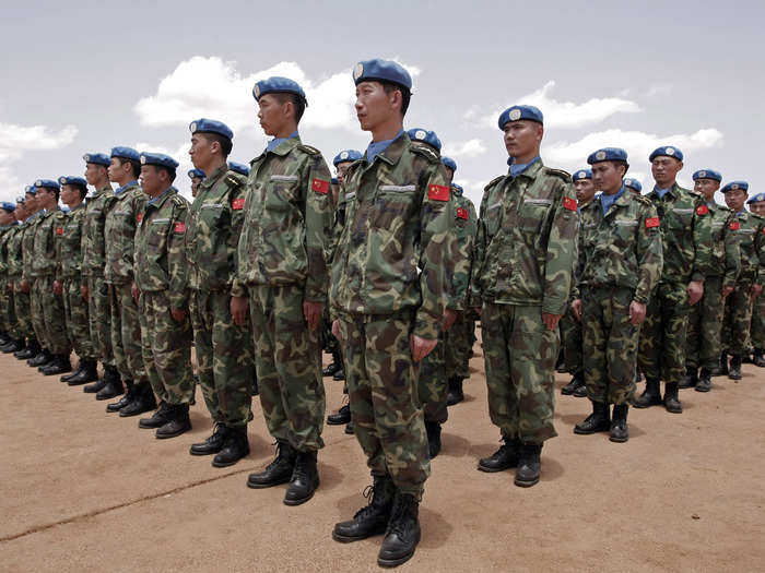 15,000 UN personnel have been deployed to Darfur. Here, newly arrived engineers from China stand to attention after arriving in Nyala, South Darfur.