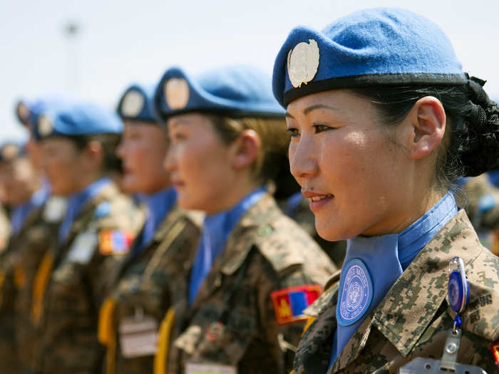 Mongolian peacekeepers of the UN Mission in the Republic of South Sudan stand in formation during a medal ceremony at their base in Bentiu, South Sudan.