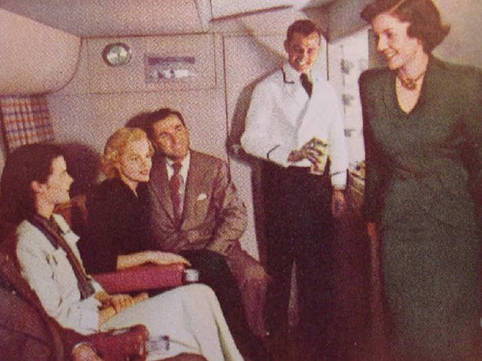 Some planes had lounges in the coach section for flights. This picture is from the 1950s.