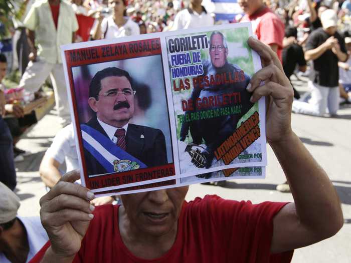 A military coup ousted former president Manual Zelaya in 2009, and the tense political environment only caused more problems. Here, one of his supporters holds his photo during a protest in San Pedro Sula, many of which turned violent.