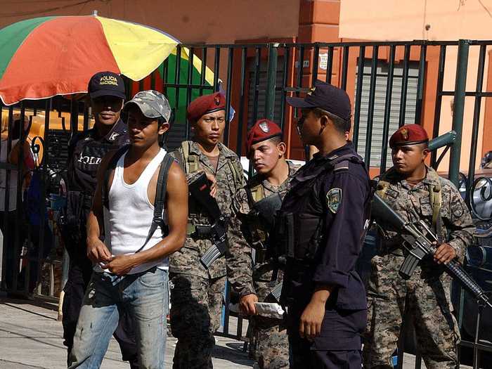 A shocking incident in 2010 saw 18 people massacred in a shoe shop as part of a gang war. This photo shows police searching for weapons the very next day.