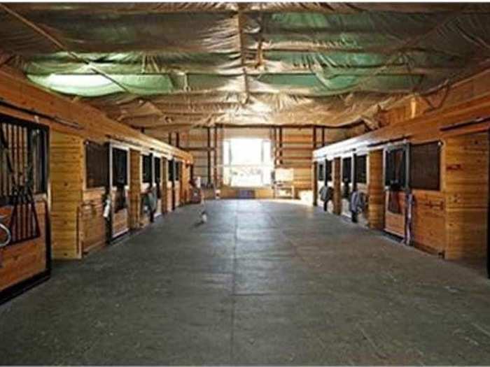 This nine-stall barn is an ideal home for your equine friends.