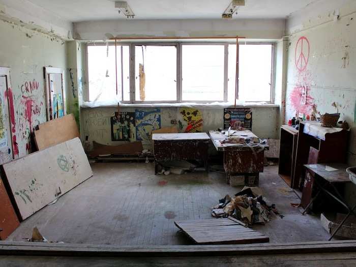 A dressing room on the top floor of the circus seems to have been used more recently as an art studio.