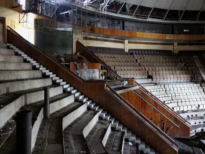 Tiered concrete seating surrounds the main arena of the circus.