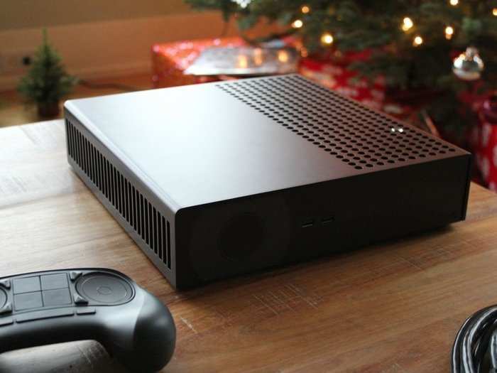 The Steam Machine looks a lot like the Xbox One, but without the disk drive. Notice that the controller is basically a giant, clickable trackpad.