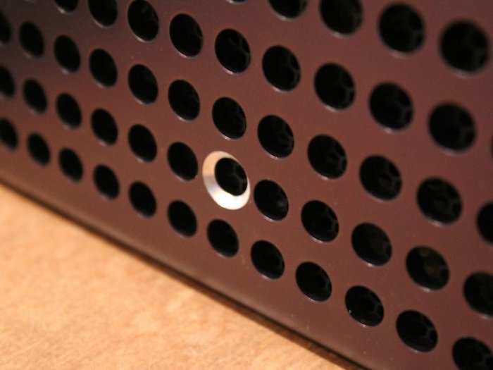 There are 300 holes on the side of the Steam Machine. Each console in this test run has a different hole "highlighted" as in the photo below.