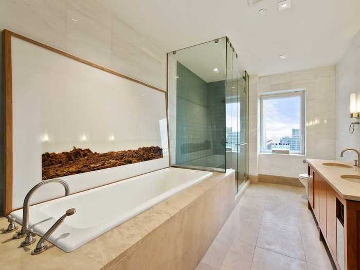 The masters suite features a six-foot soaking tub and a large glass steam shower.