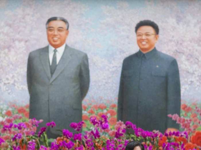 Every year, the Pyongyang Floral Festival celebrates the birthday of Kim Jung Il. At the entrance to the Floral exhibition, North Koreans take portraits in front of their leaders.