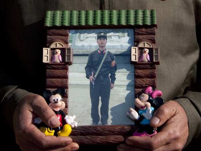 The chief of the Chilbo Sea beach village showed Lafforgue a picture of his son, who he says will stay in the North Korean army "until the reunification of Korea."