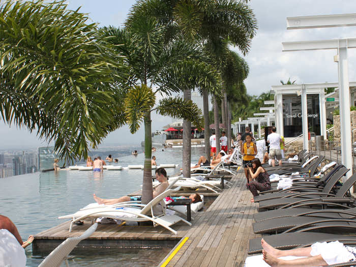 Palm trees provide shade all along the deck.