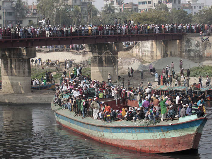 Some commuters in Dhaka, Bangladesh travel by water.