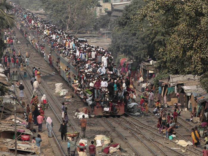 Other Dhaka residents use the roof of the train as well as its interior.