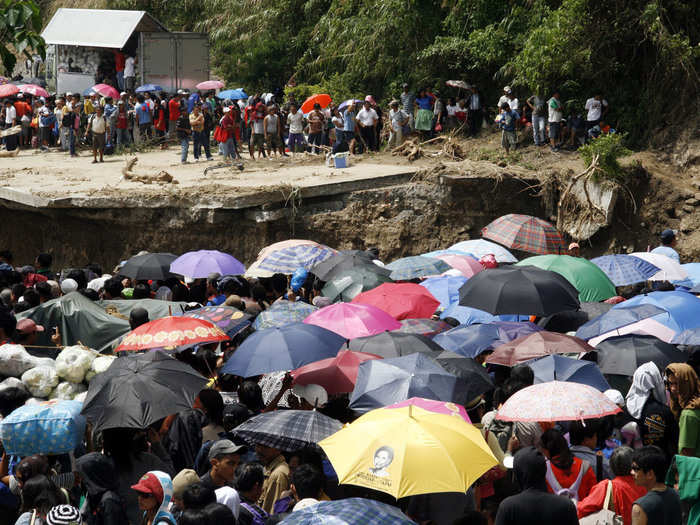 Commuters were stranded after a 2009 typhoon washed out a chunk of a Philippines highway north of Manila.