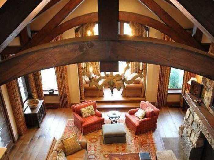 The four-story home has tall, lofted-beam ceilings