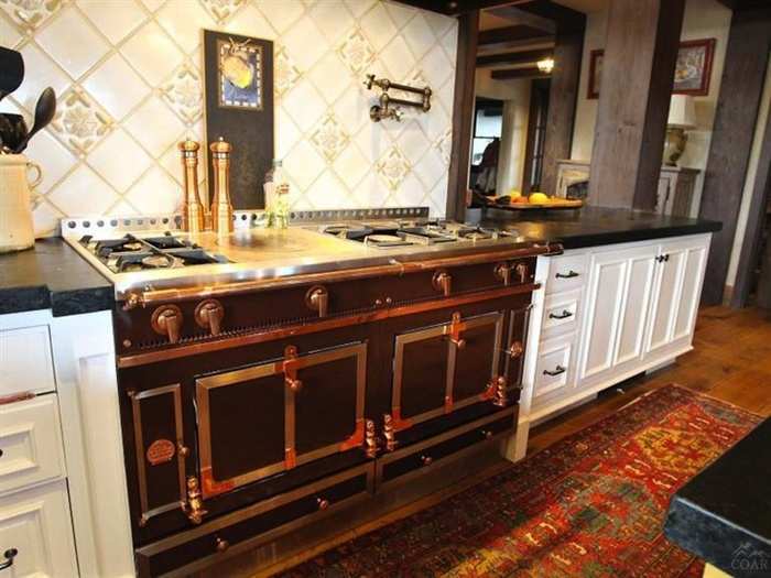 It has marble counter tops and an antique-style stove