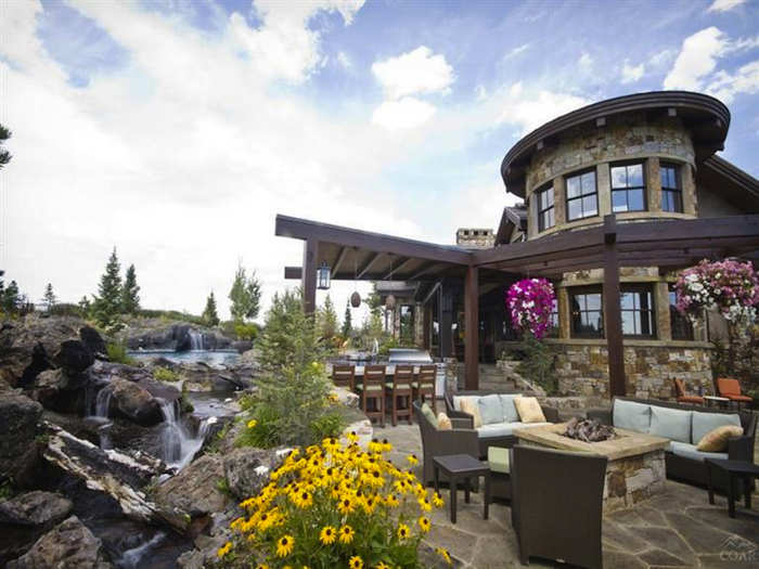 Outside the house is the incredible patio with a mini bridge, waterfalls, and streams