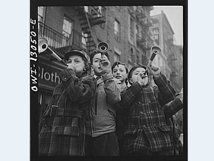 1943: Children blew horns on Bleecker Street in New York City on New Year