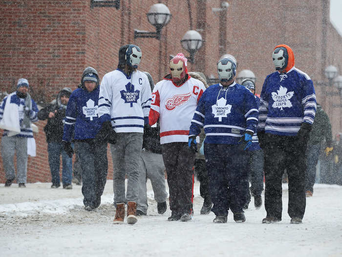 The fans came up with unique ways to stay warm including Iron Man masks.