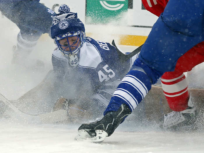 Jonathan Bernier scrambles for a save as snow flies all around him.