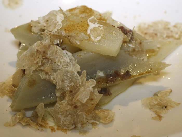 Truffles are used on a variety of dishes, from risotto and mashed potatoes to buttery pasta. Pictured here is a dish of cardoon with white truffle and pear, served at Guido Ristorante in Serralunga d