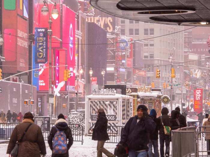 Tourists and commuters were both out, seeing what snowstorm Hercules left behind and trying to stay warm.