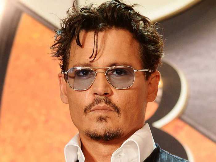 Johnny Depp had rock musician dreams when he quit high school.