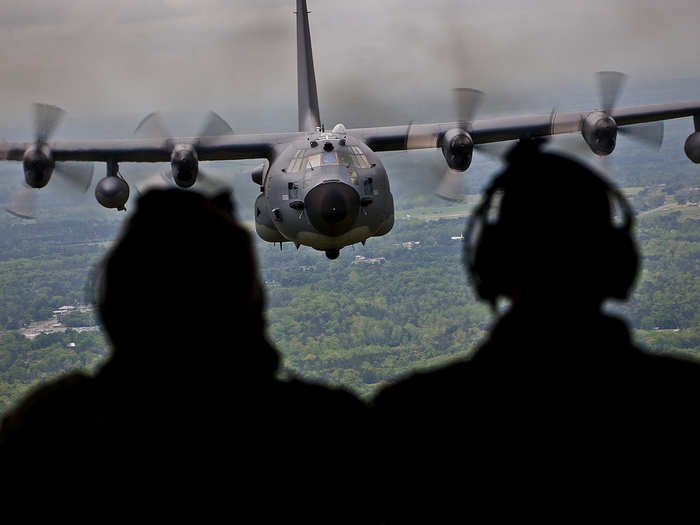 Aircrew members admire their MC-130E Combat Talon I in flight one last time during its final flight before retirement. The last five MC-130s in the Air Force belong to the 919th Special Operations Wing at Eglin Air Force Base, Fla. (U.S. Air Force photo/Tech. Sgt. Samuel King Jr.)