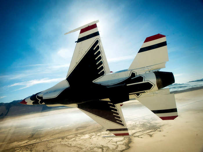 The Thunderbirds diamond formation performs the echelon pass in review maneuver during a training sortie over a range in Nevada. (U.S. Air Force photo/Tech. Sgt. Manuel J. Martinez)