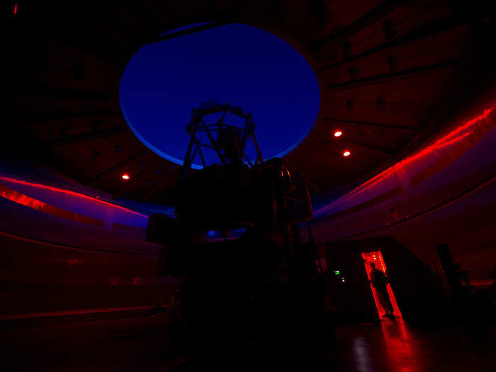 Capt. Shahn Rashid stands inside the Advanced Electro Optical System. The system is a 3.67 meter telescope space surveillance system specifically designed to improve the means of collecting, and the quality of, space data at the Maui Space Surveillance Complex facility in Hawaii. Primarily intended for Department of Defense space surveillance missions, the telescope is also used by scientific and academic astronomy communities from across the United States. (U.S. Air Force photo/Tech. Sgt. Bennie J. Davis III)