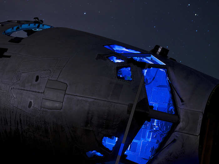 The cockpit section of a C-141 Starlifter sits dissected and strapped to the ground of the 309th Aerospace Maintenance and Regeneration Group