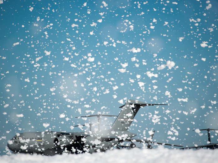 A small sea of fire retardant foam was unintentionally released in an aircraft hangar, temporarily covering a small portion of the flightline at Travis Air Force Base, Calif. The non-hazardous foam is similar to dish soap, which eventually dissolved into liquid. Firefighters from the 60th Air Mobility Wing helped control the dispersion by using powerful fans and covering drains. No people or aircraft were harmed in the incident. (U.S. Air Force photo/Ken Wright)